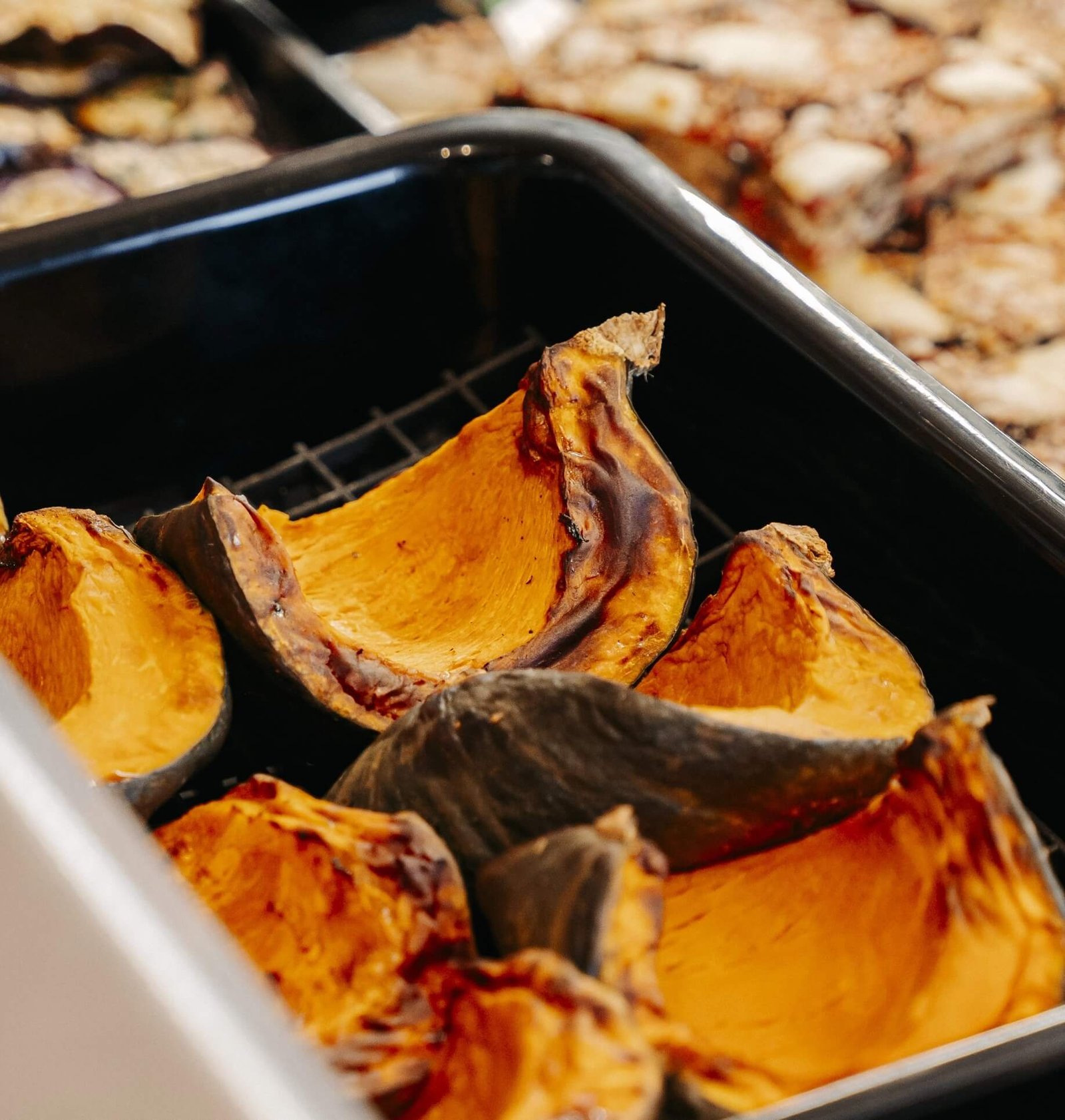 Fette di zucca al forno nella gastronomia Carlo Poma